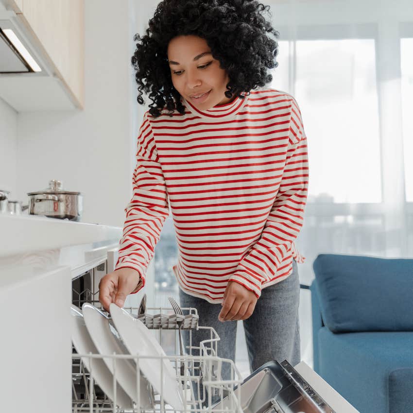 perfect organizer loading her dishwasher