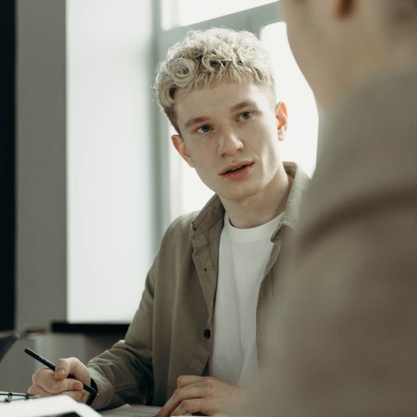 confident man offending friend by telling him to just be happy