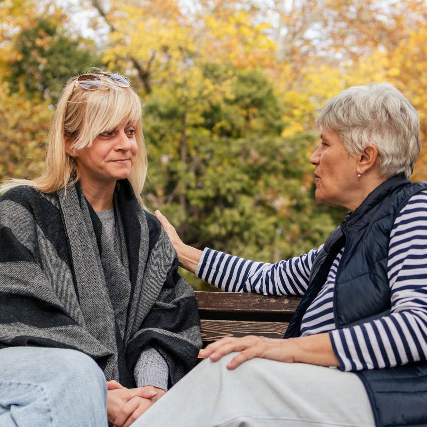 woman losing the capacity to care what others think telling friend on park bench i don't take things personally