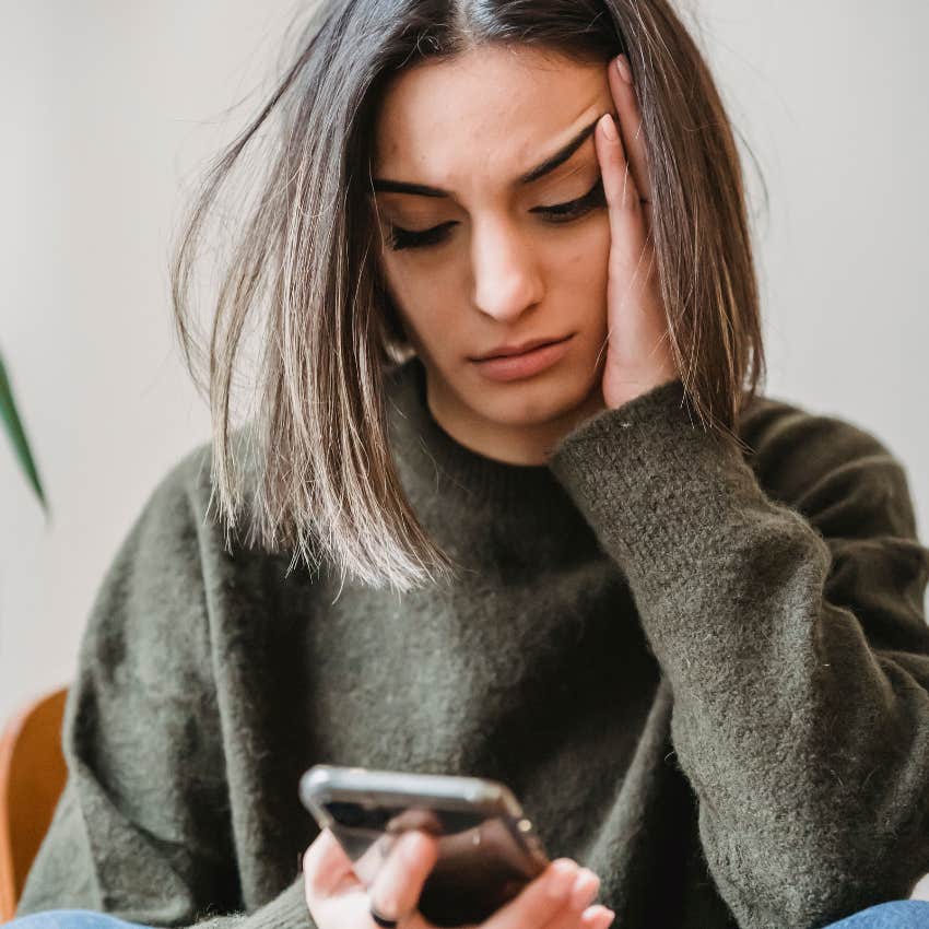 unmotivated woman texting maybe later not wanting to do anything new