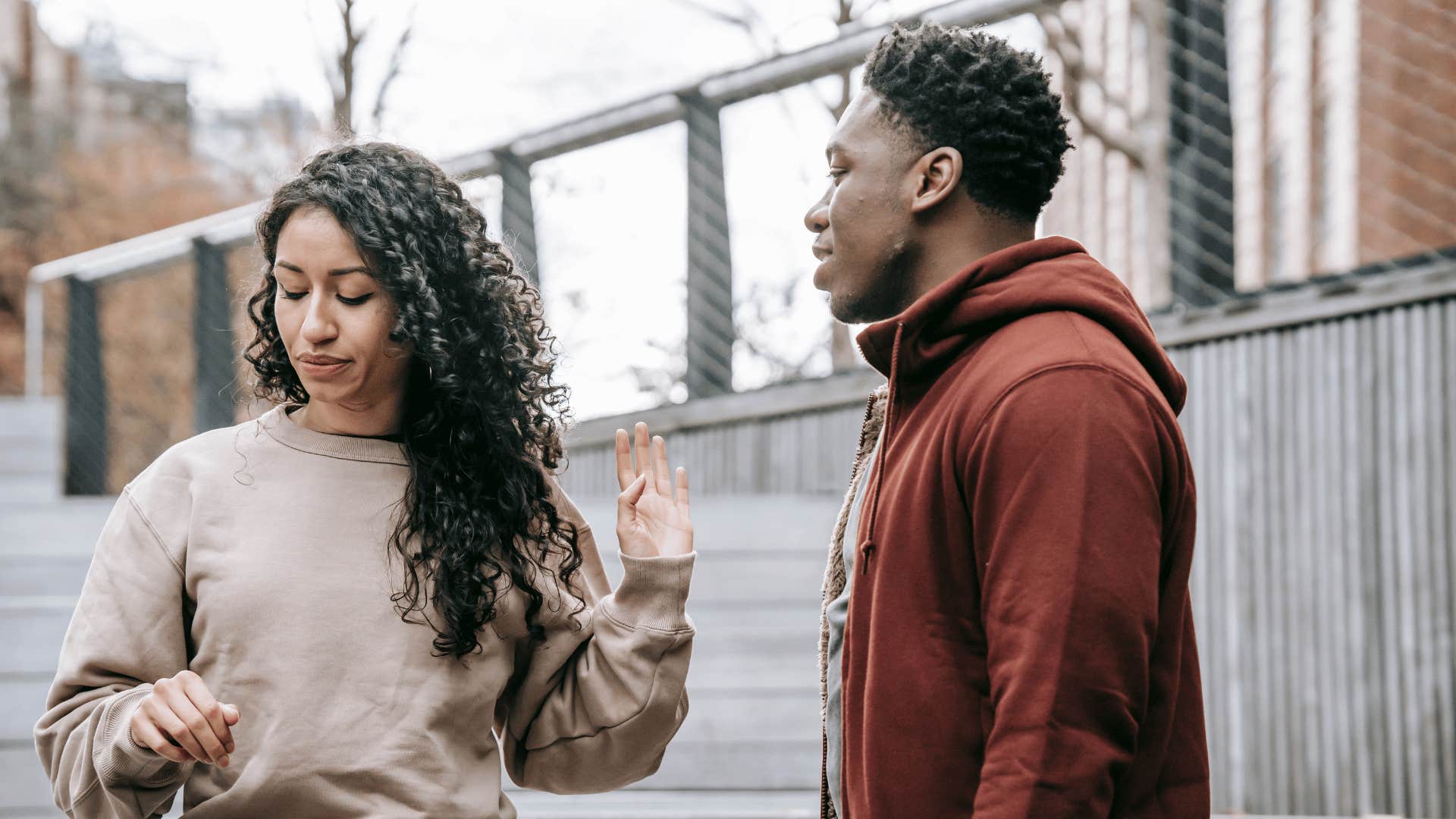 woman turned away from man not wanting to have a conversation