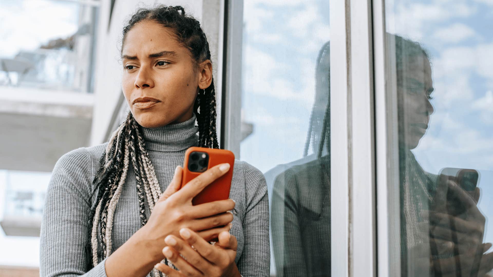 low-energy woman scared to look at bad news on her phone
