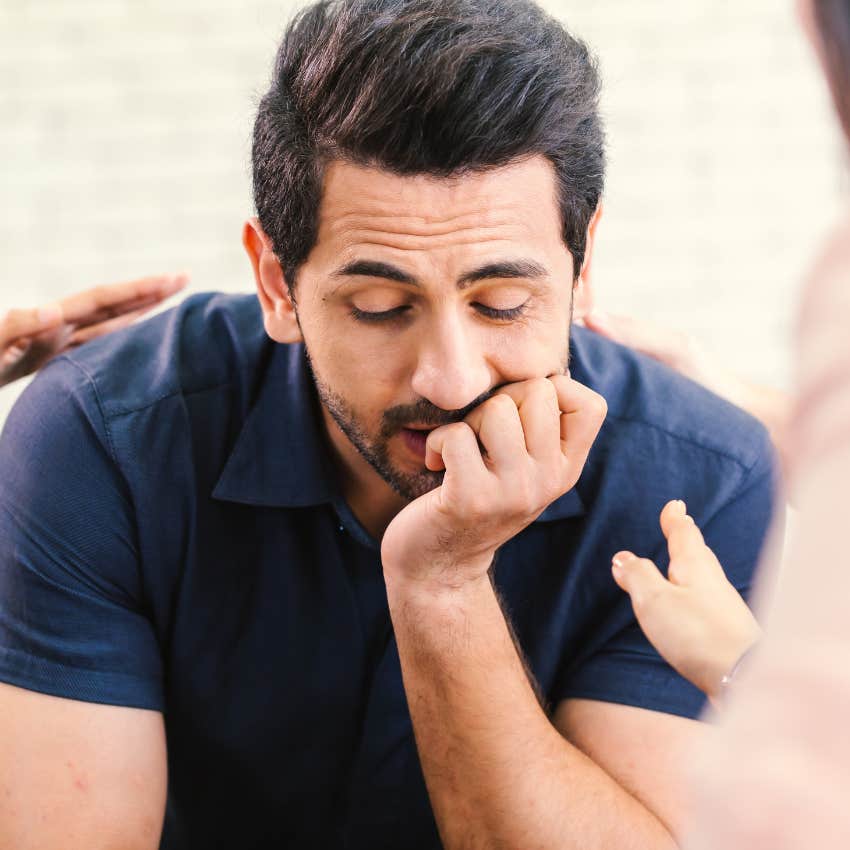 sad man with no sense of purpose being comforted by friends