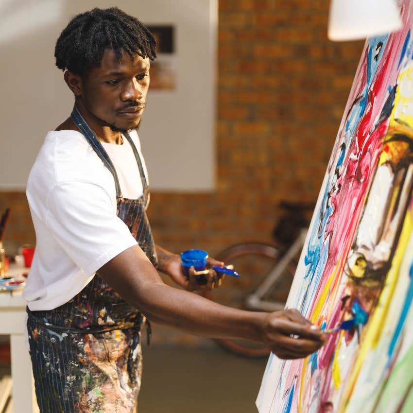 man looking for a way to feel safe painting on canvas at home