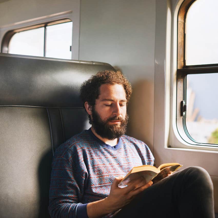 man who doesn't mind spending time alone by reading fiction