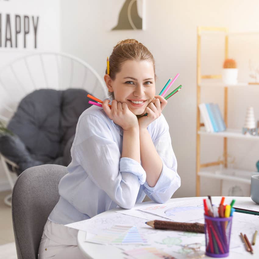 woman who struggles to turn her brain off relaxes while coloring