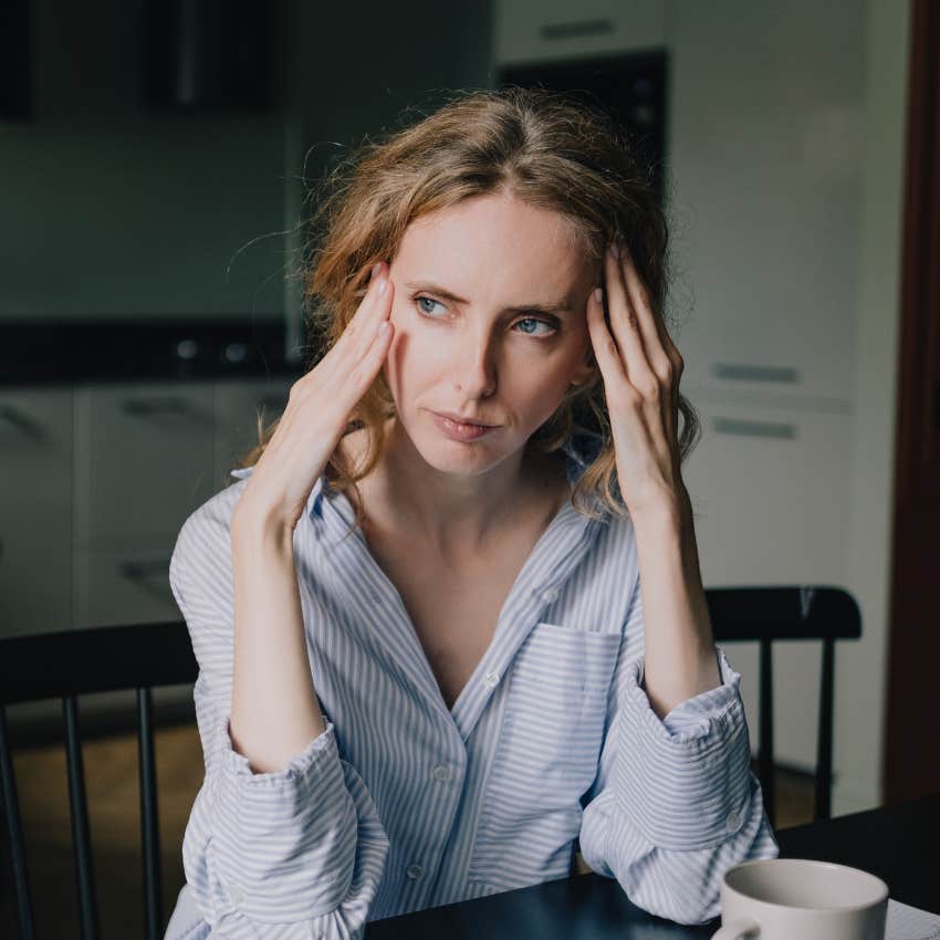 woman going through the motions because she's tired of carrying the mental load of her household