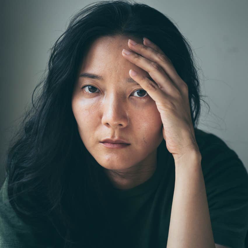 sad woman hiding her feelings due to childhood loneliness