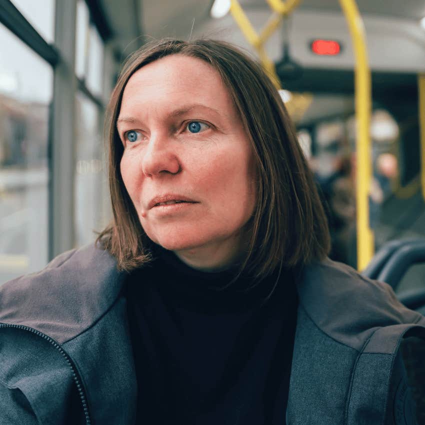 serious woman on her morning bus ride