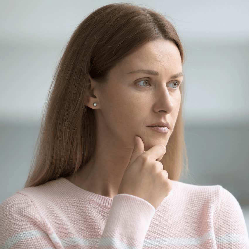 serious woman thinking about ending up lonely after a divorce