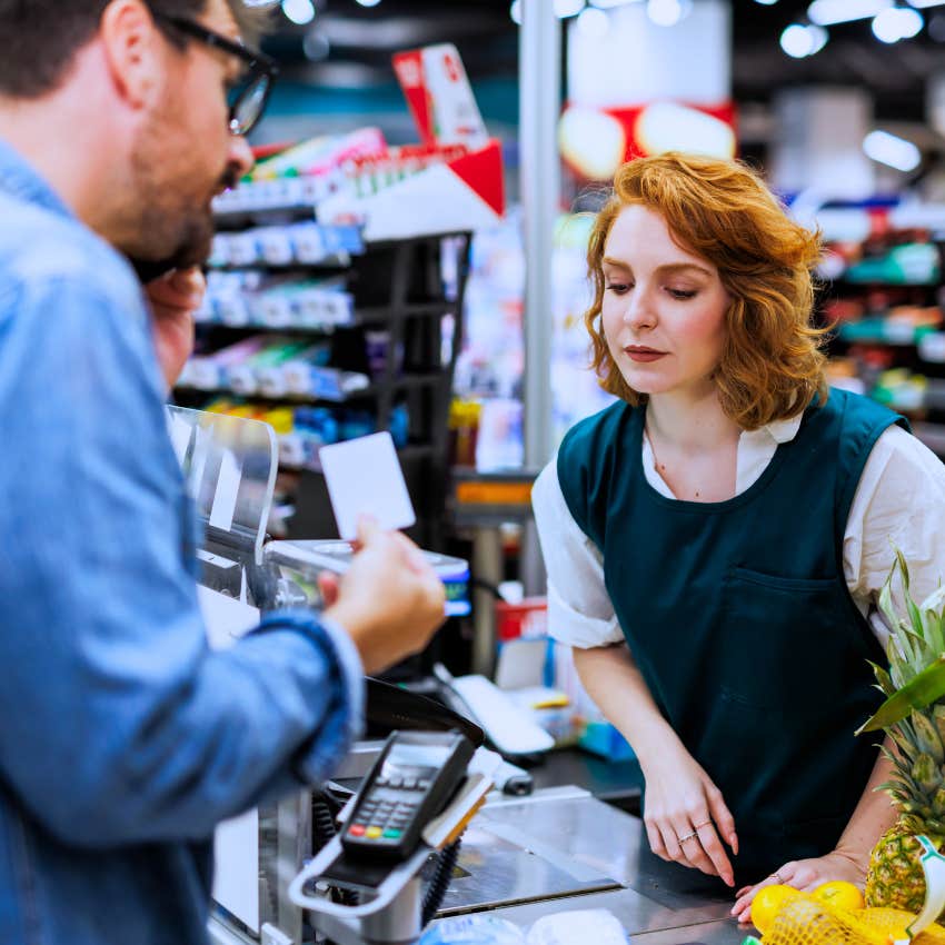 socially anxious man in the checkout line at the store