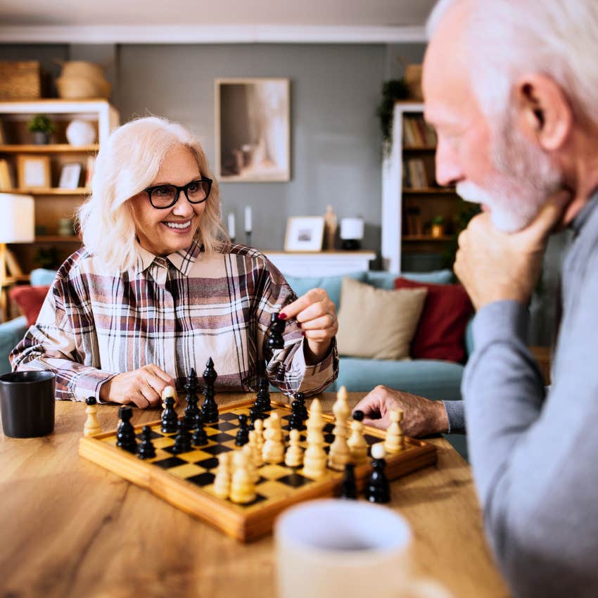 man getting to know his partner's hobbies and interests playing chess