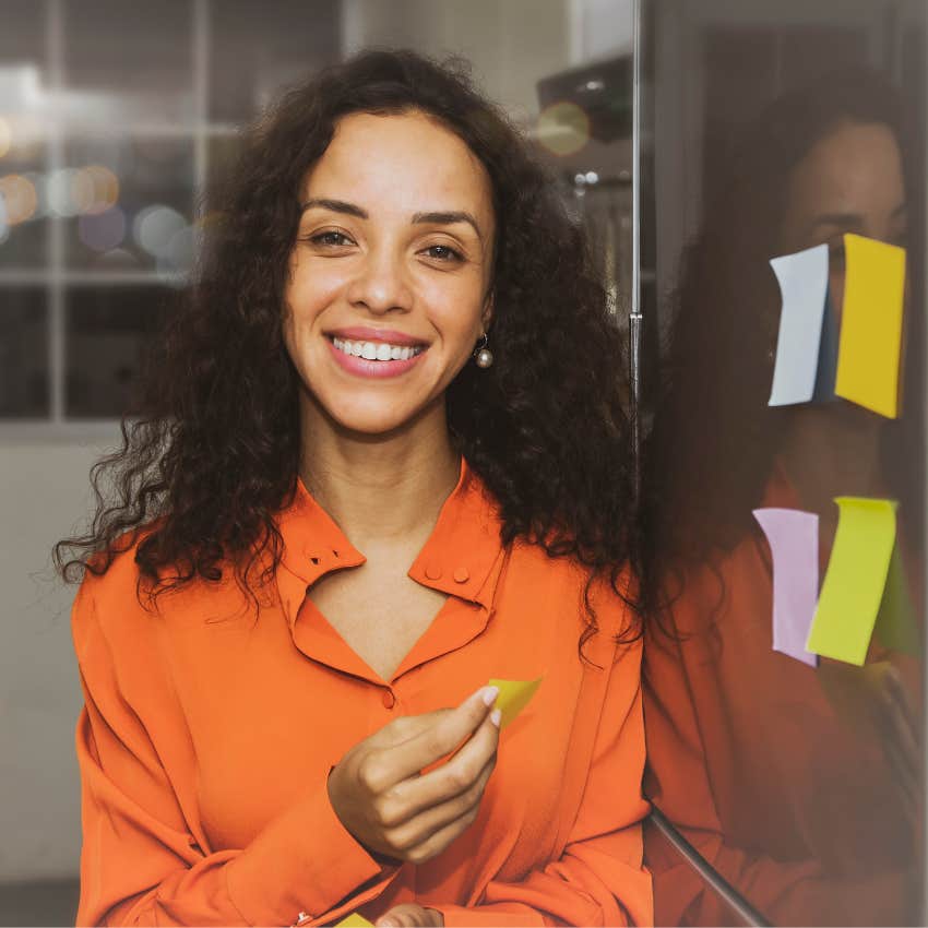 happy woman with a big heart leaving notes for a loved one to see