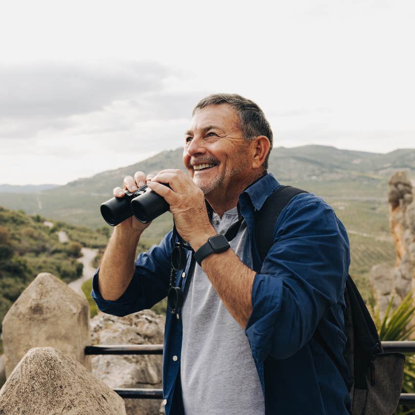 man over 60 happily looking at view focuses on the positives of life
