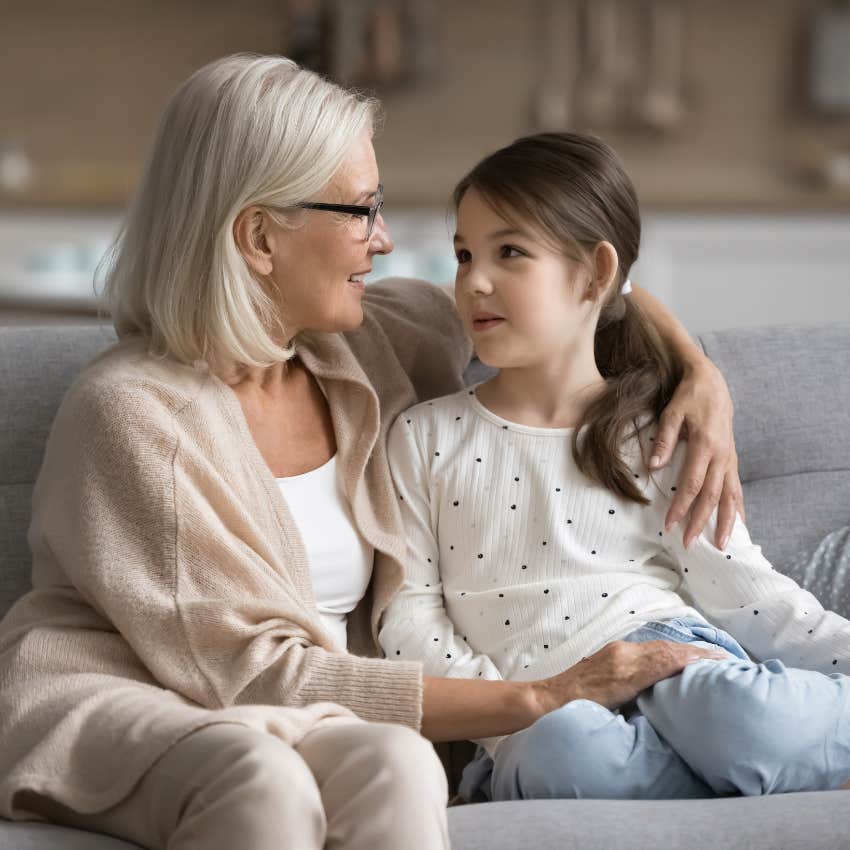 happy grandmother imparting wisdom on granddaughter 