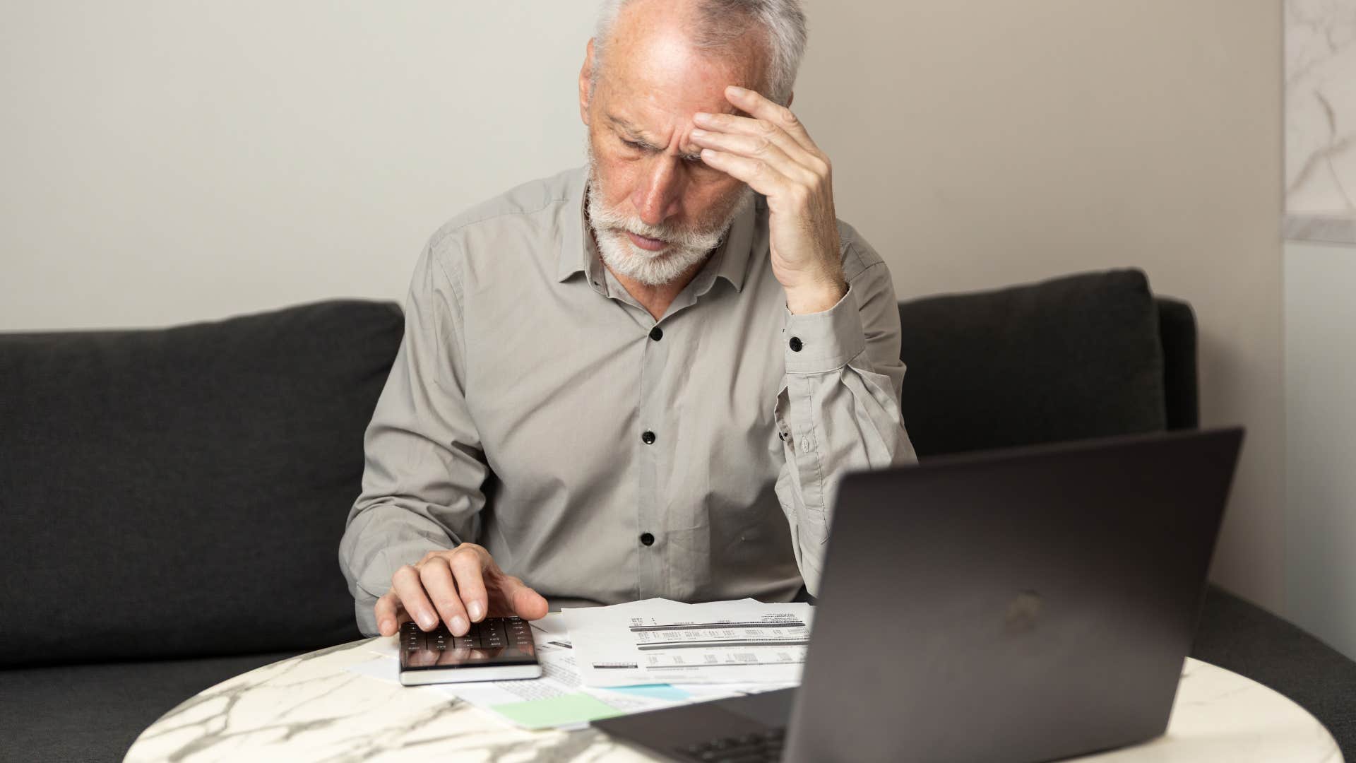 boomer man trying to budget with limited finances doesn't talk about it