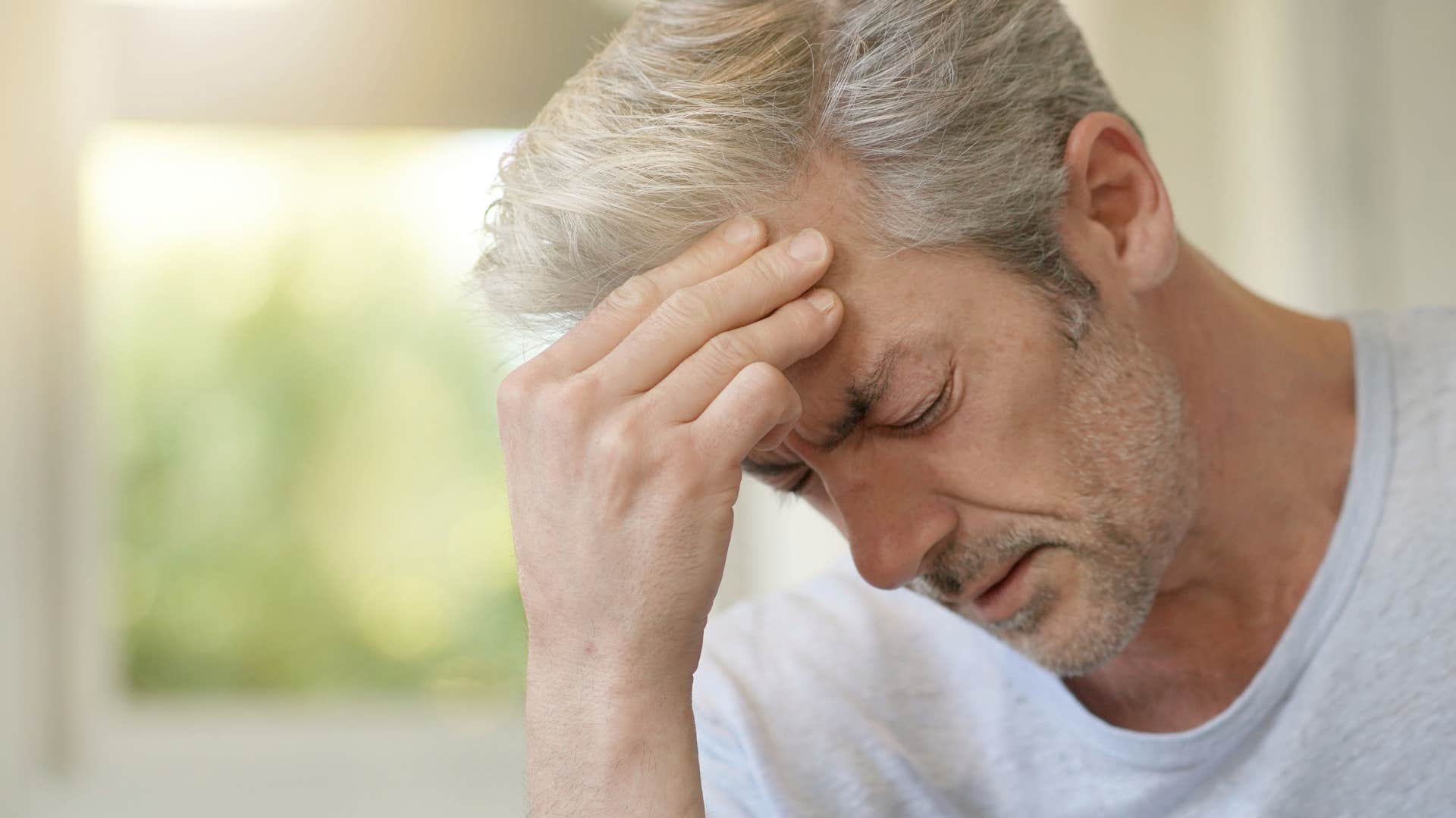 gen x man feeling sad silently dealing with unprocessed grief