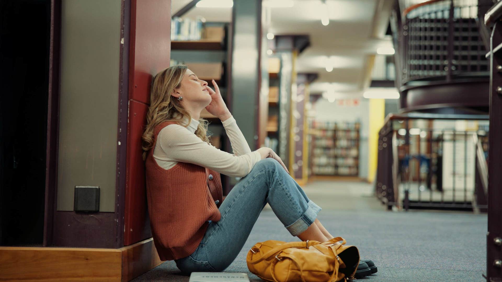 stressed gen Z university student in the library