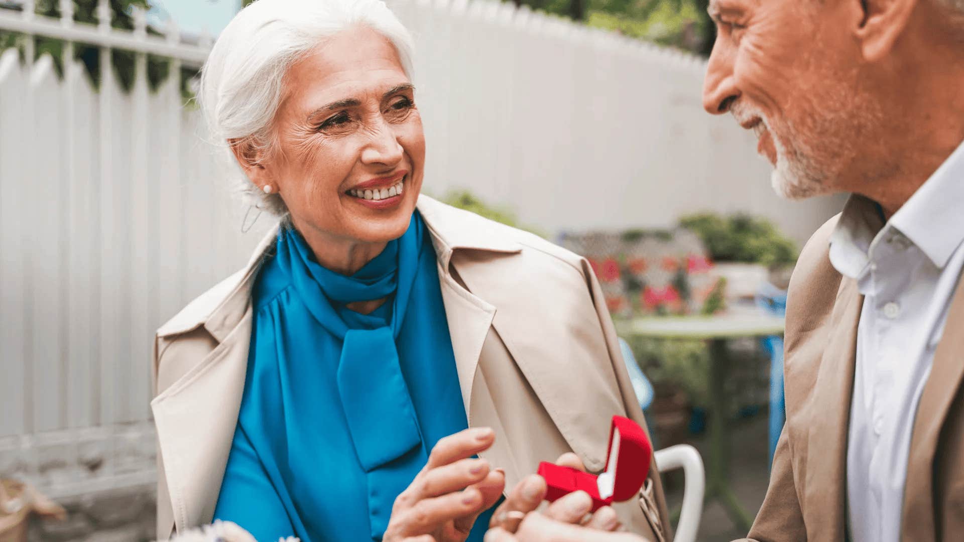 boomer woman accepting partner's proposal with diamond ring