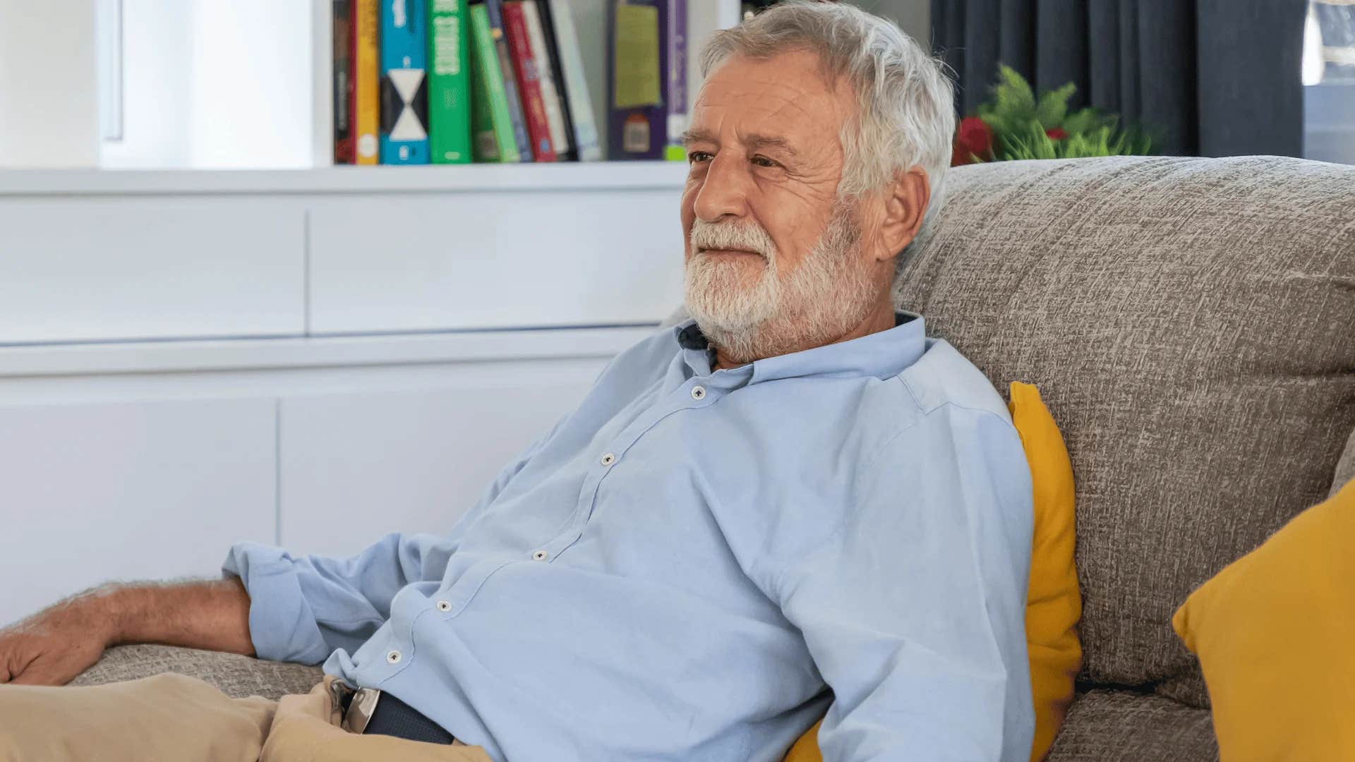happy boomer man sitting in a recliner at home