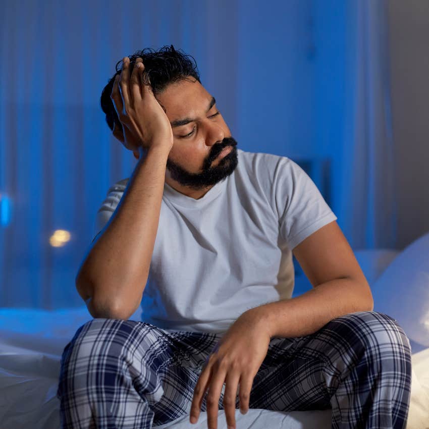 emotionally drained man who can't sleep because anticipatory anxiety makes him dread monday