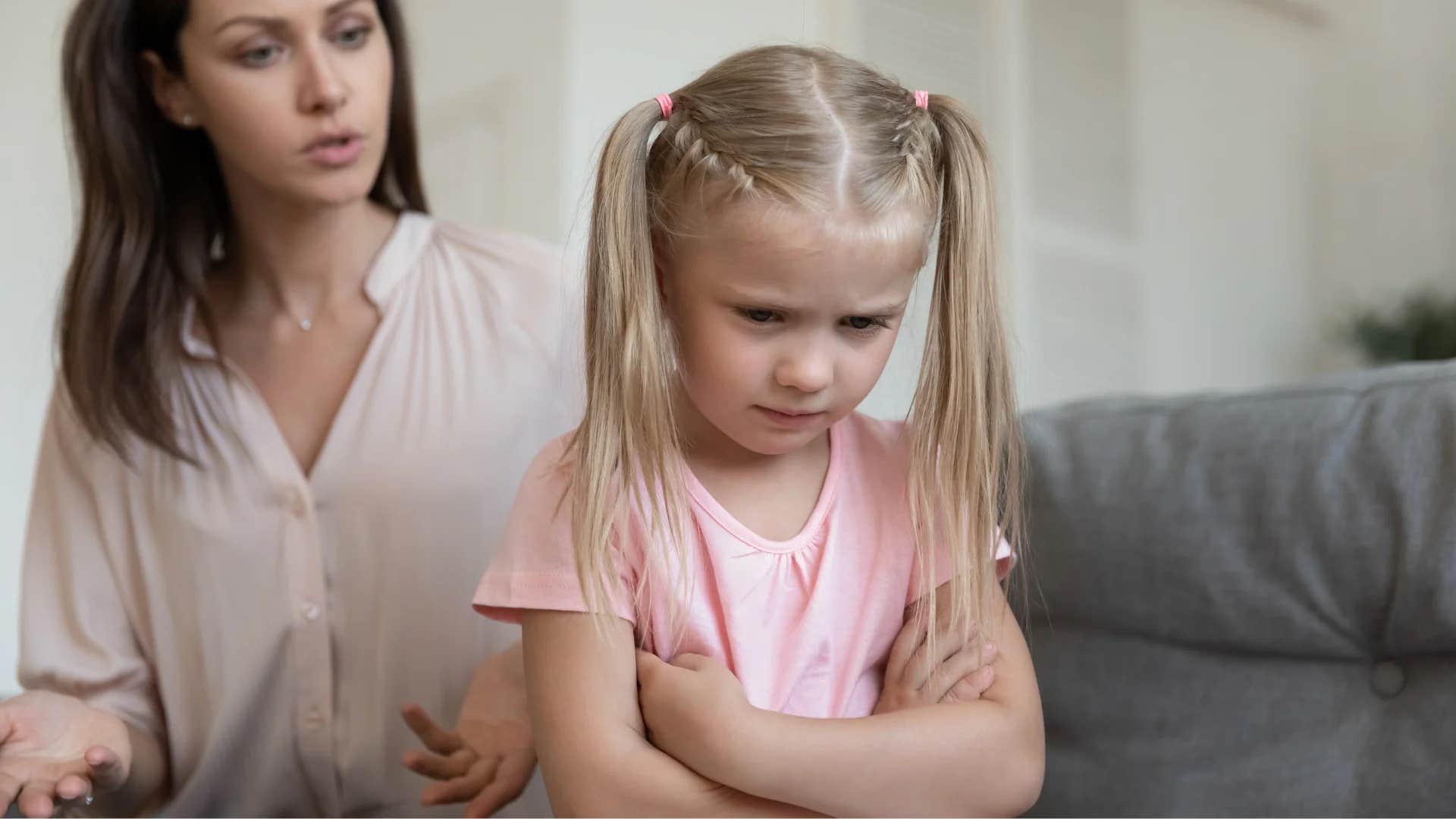 mom talking to upset daughter about taking responsibility for her mistakes
