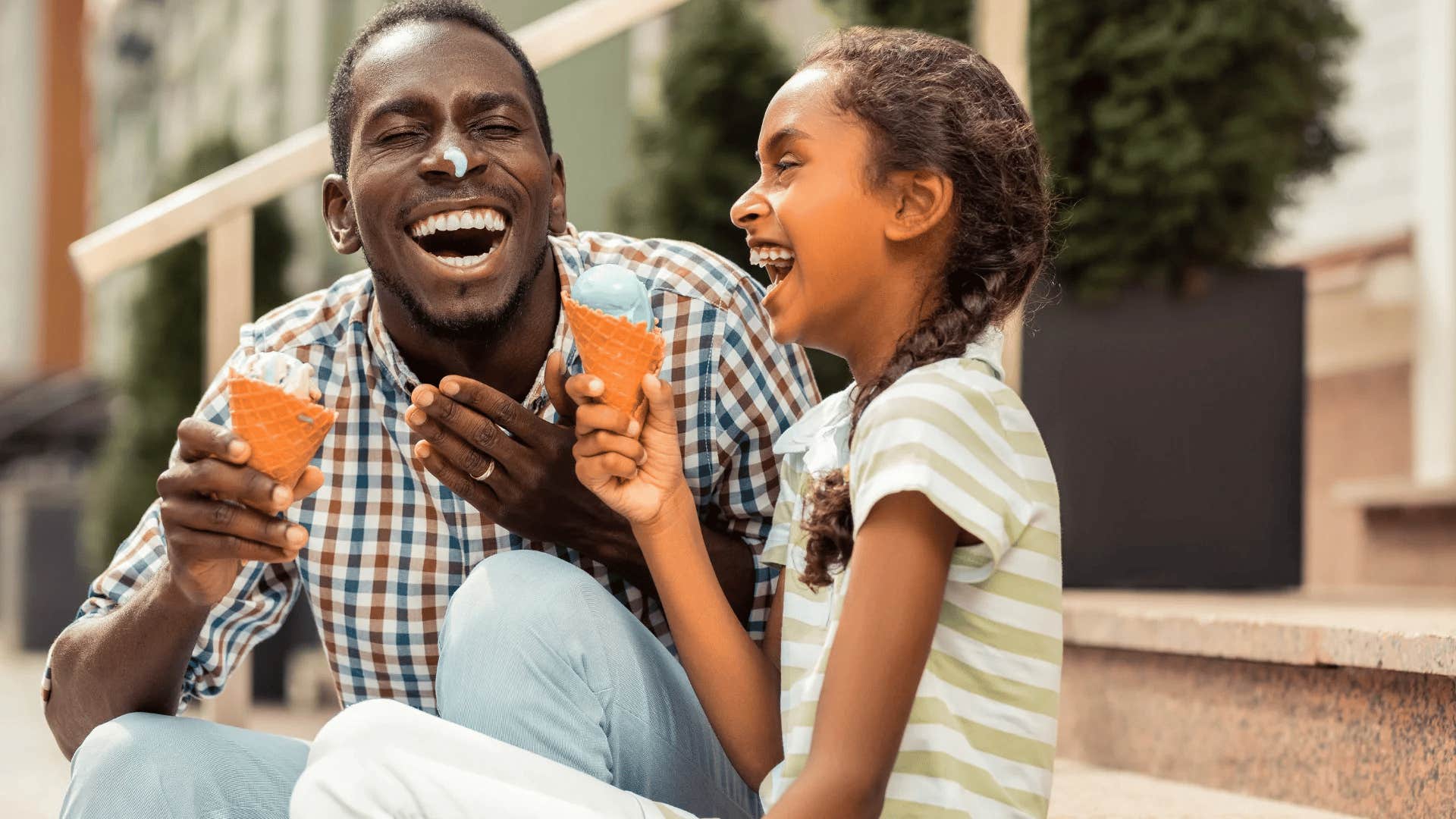 dad treating his daughter to ice cream for fun