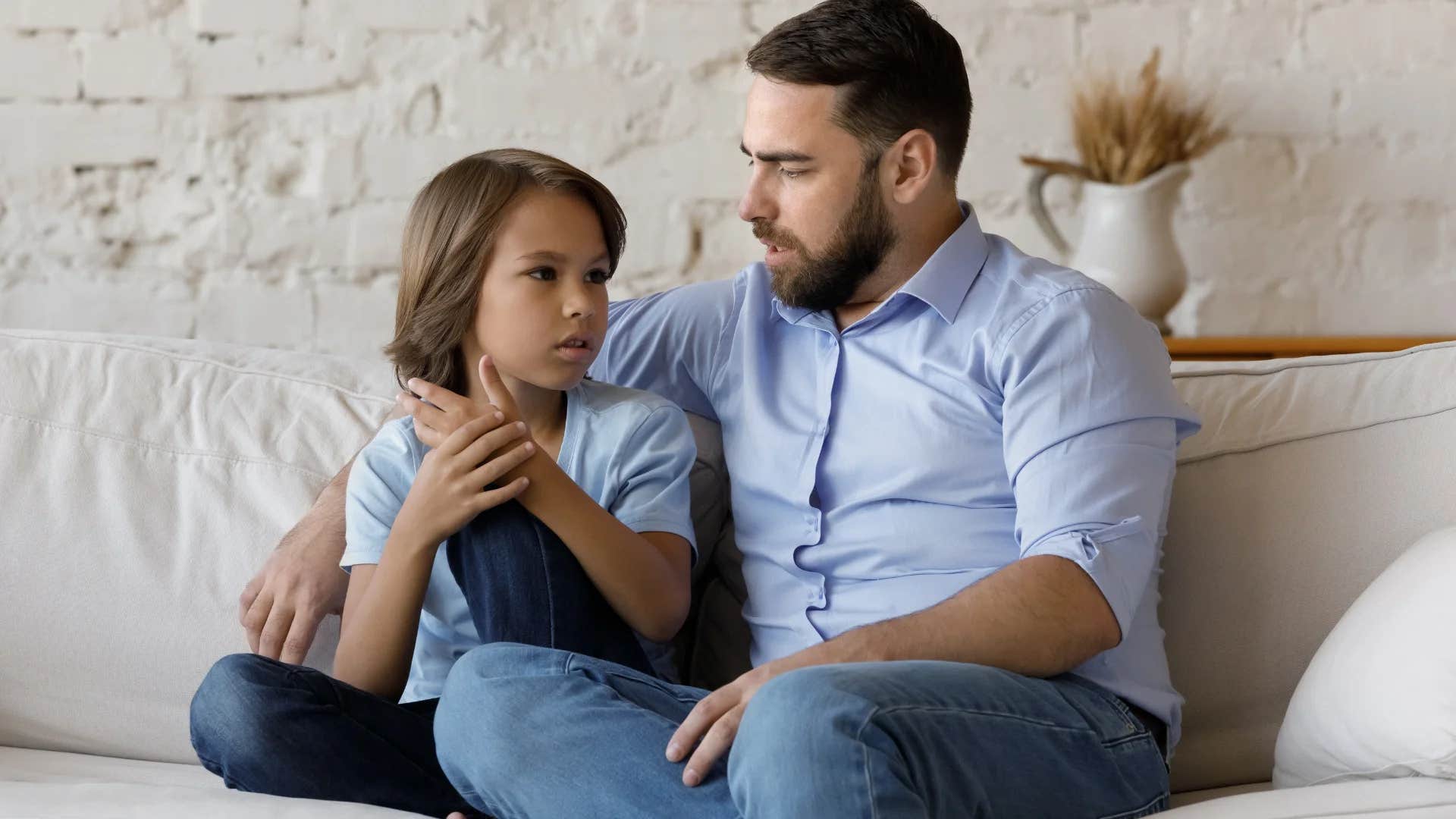 father sitting down with son for a family check-in