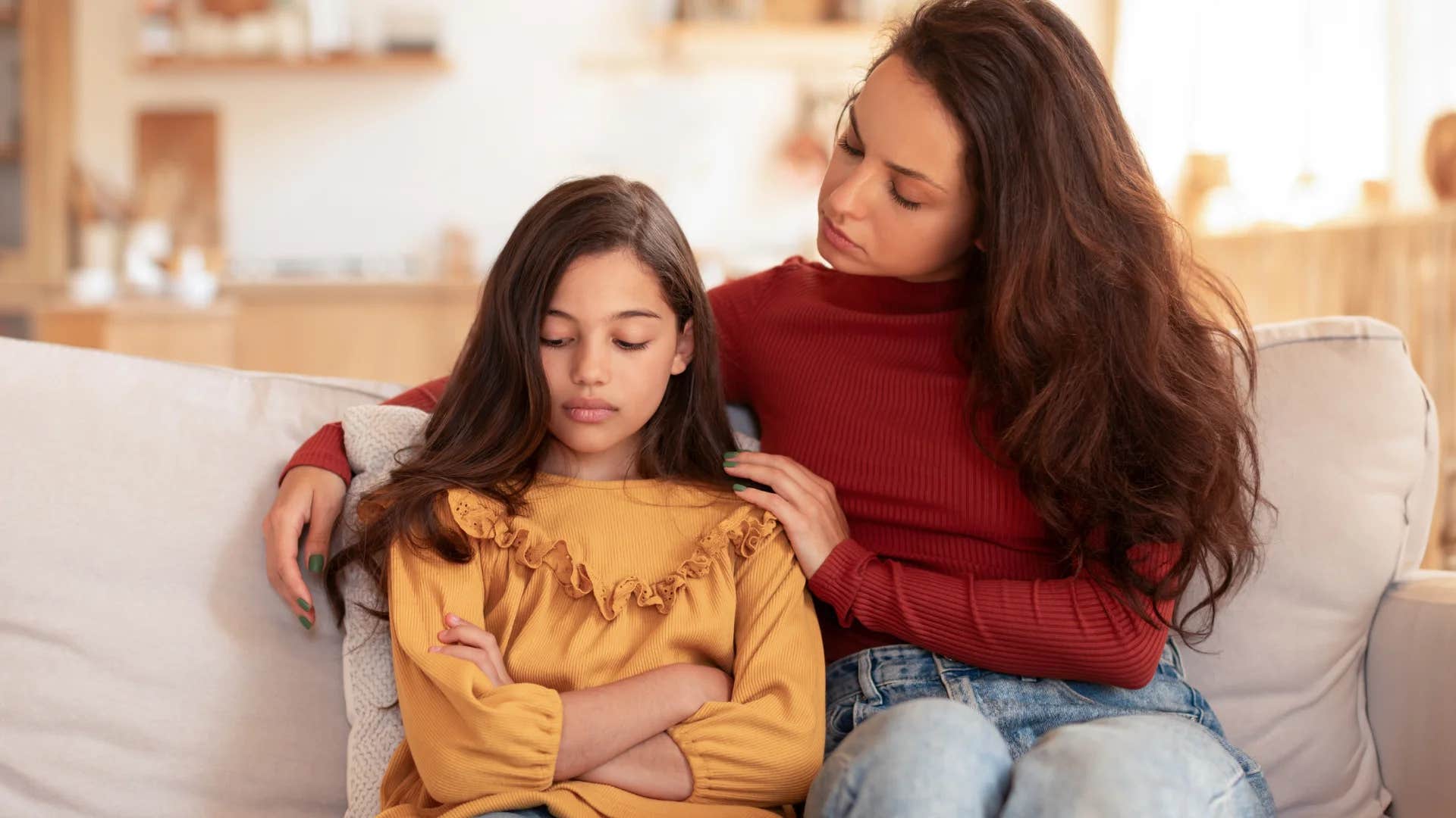 mother talking to daughter teaching her not to be angry when she argues