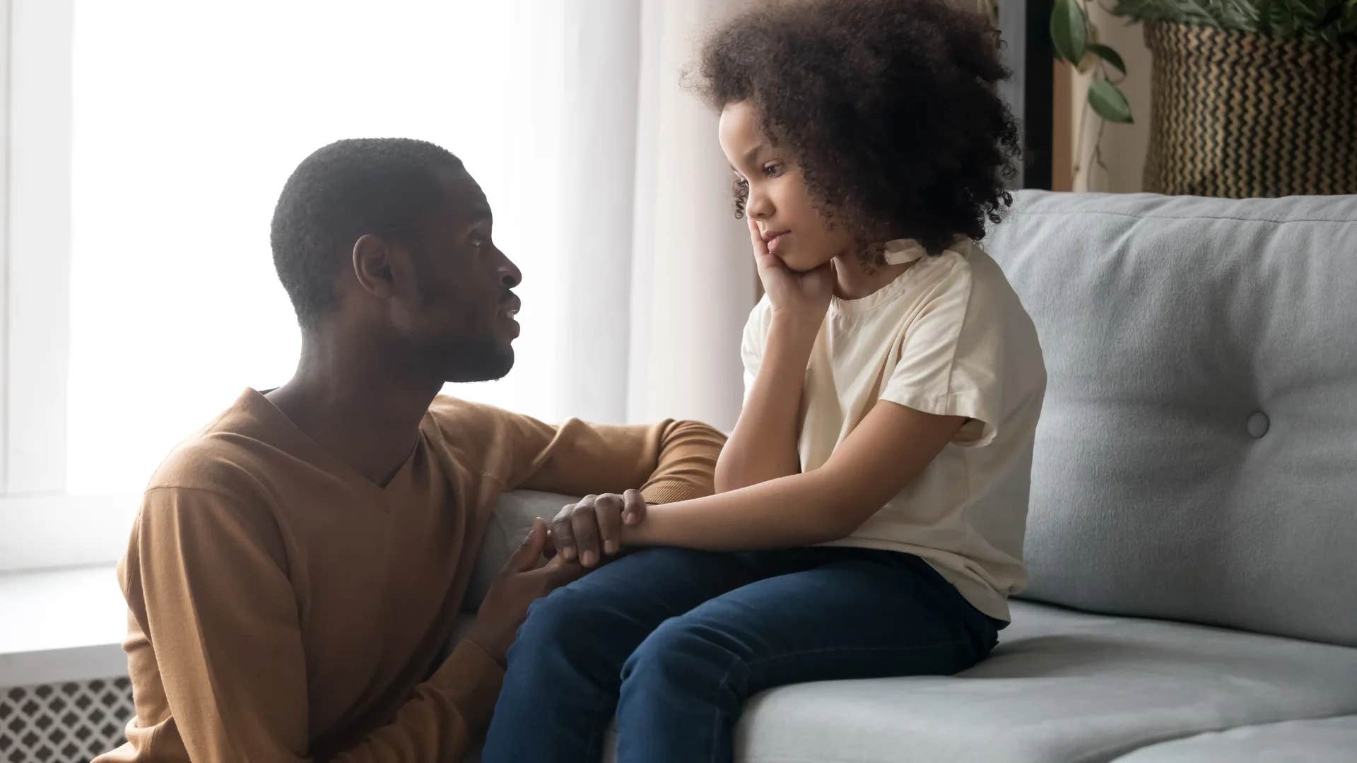 dad teaching his daughter the important of saying no