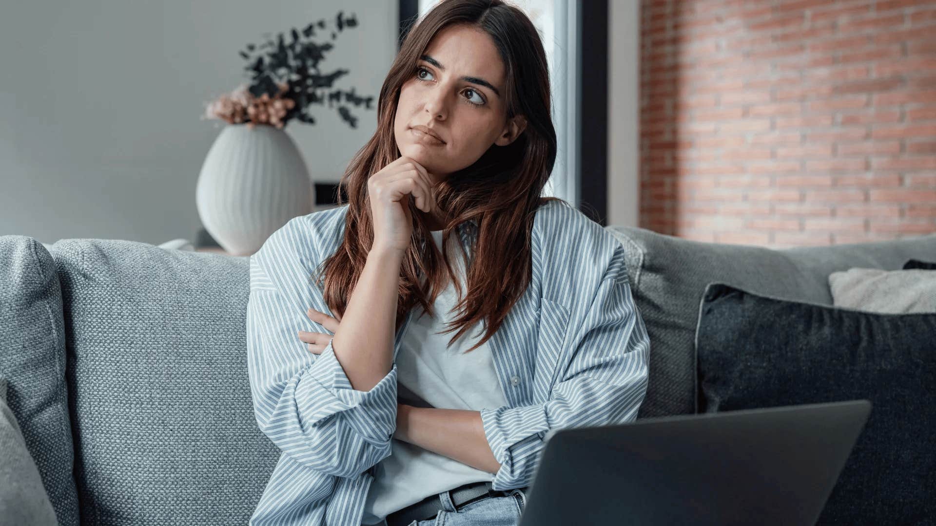 highly intelligent woman suffering with imposter syndrome at home