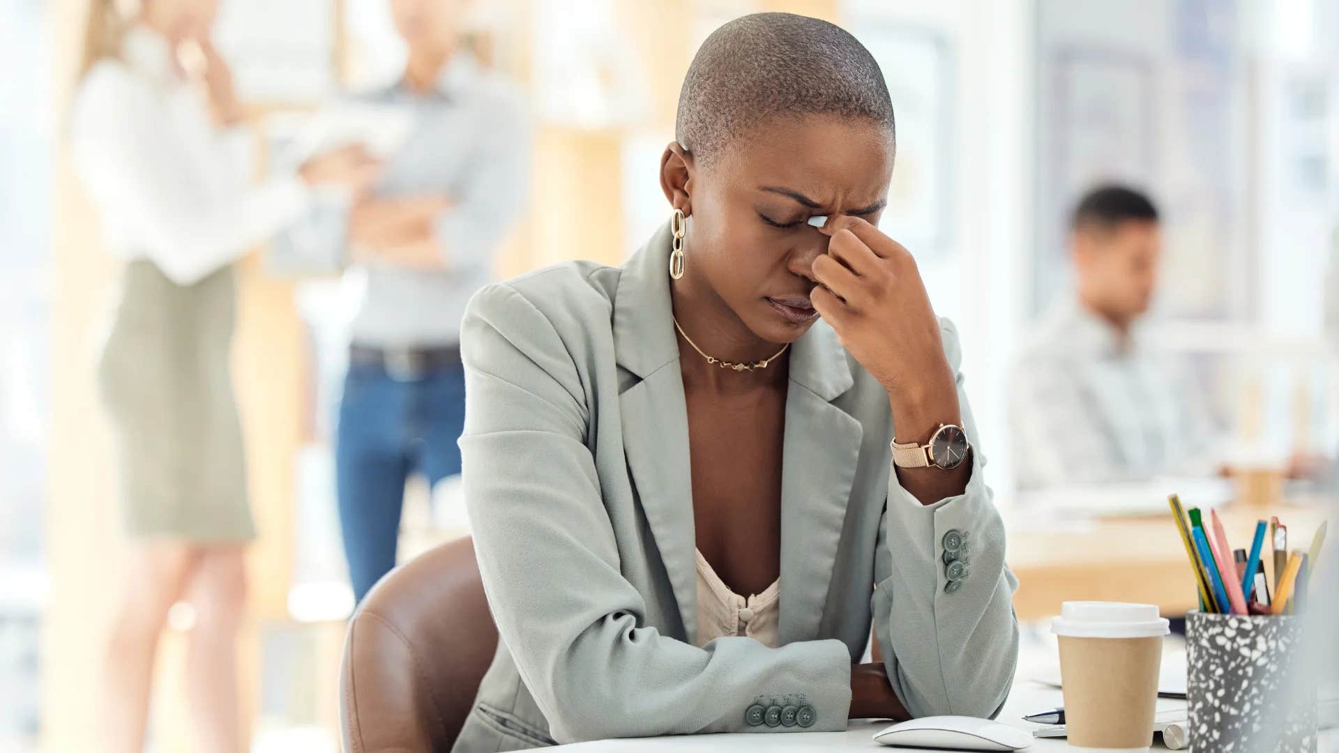 intelligent woman looking stressed out at work
