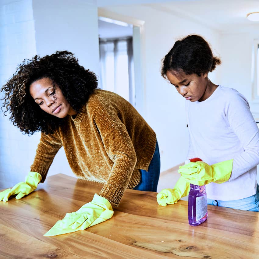 mom teaching her kids how to do chores at home