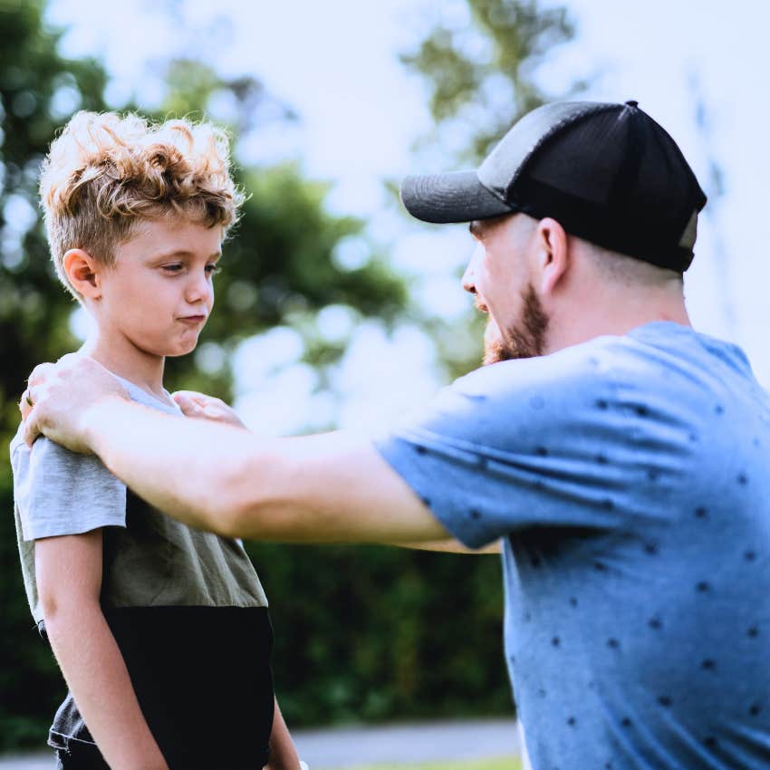 Man teaching his child street smarts on purpose