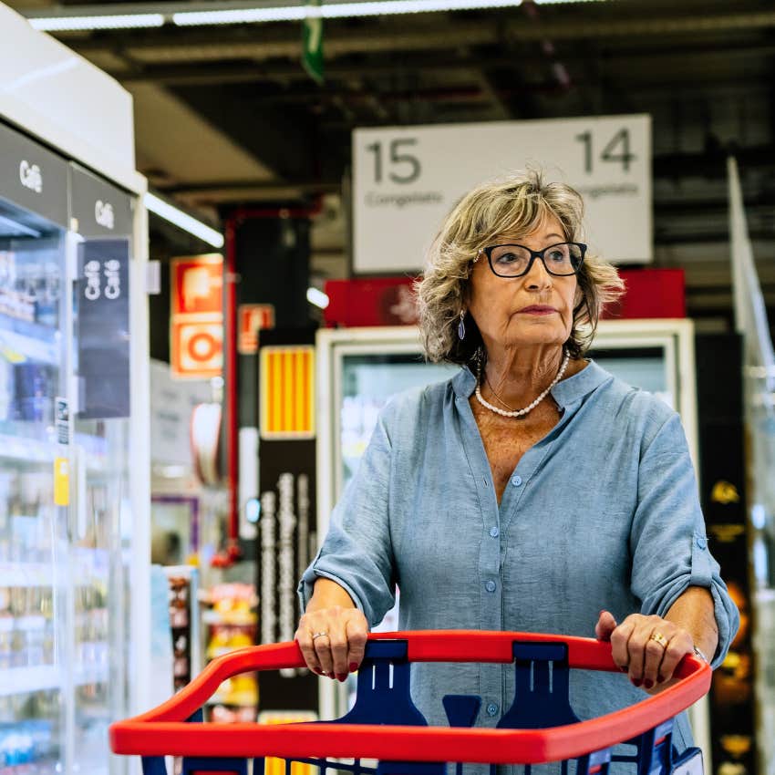 lonely older woman at the grocery store buying things as social substitutes