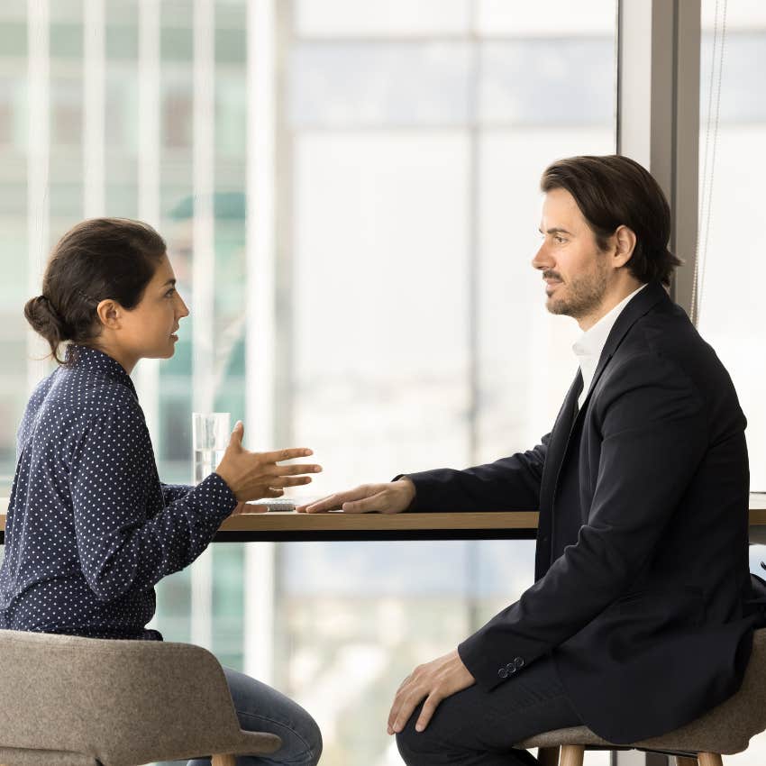 woman who almost always gets what she wants helping a colleague solve a problem