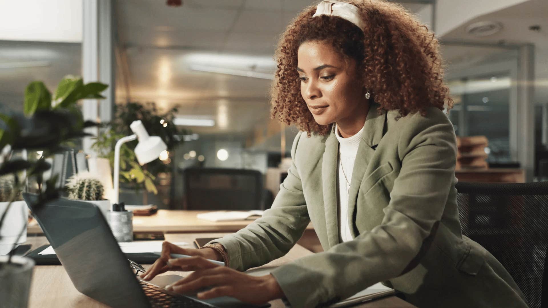 gen X woman wearing traditional officewear while working