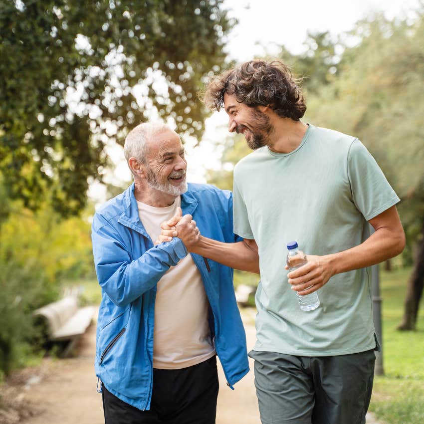 boomer dad shaking hands with adult son who he still brags about