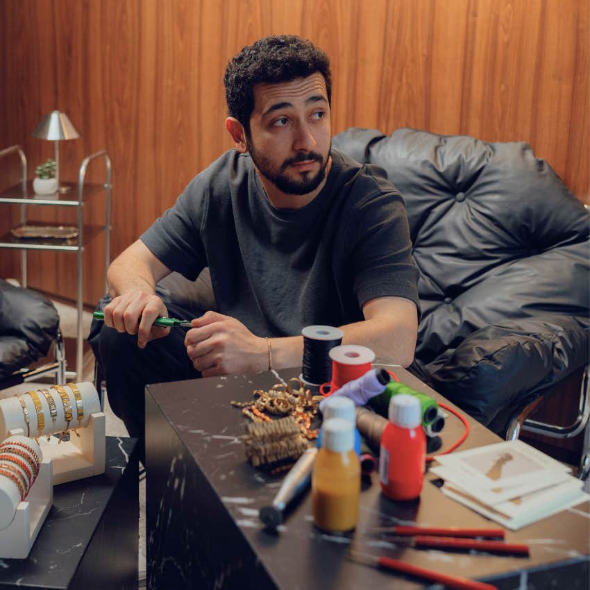 neurodivergent man recharging with his creative interests at home