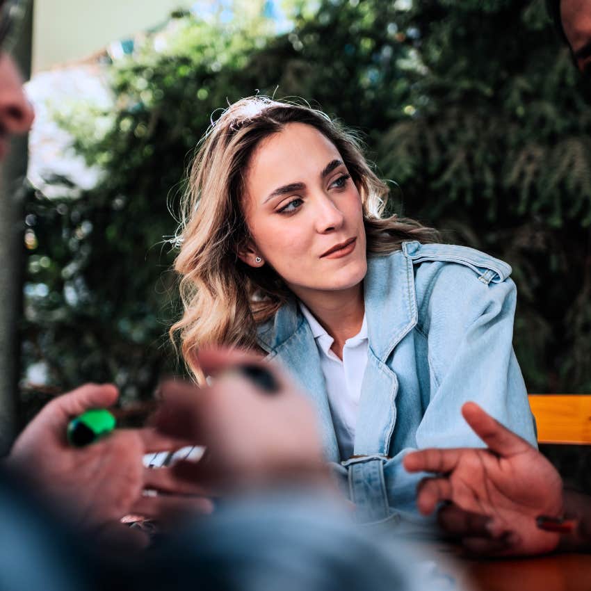 Creative and curious woman not having space to talk during meetings at work.