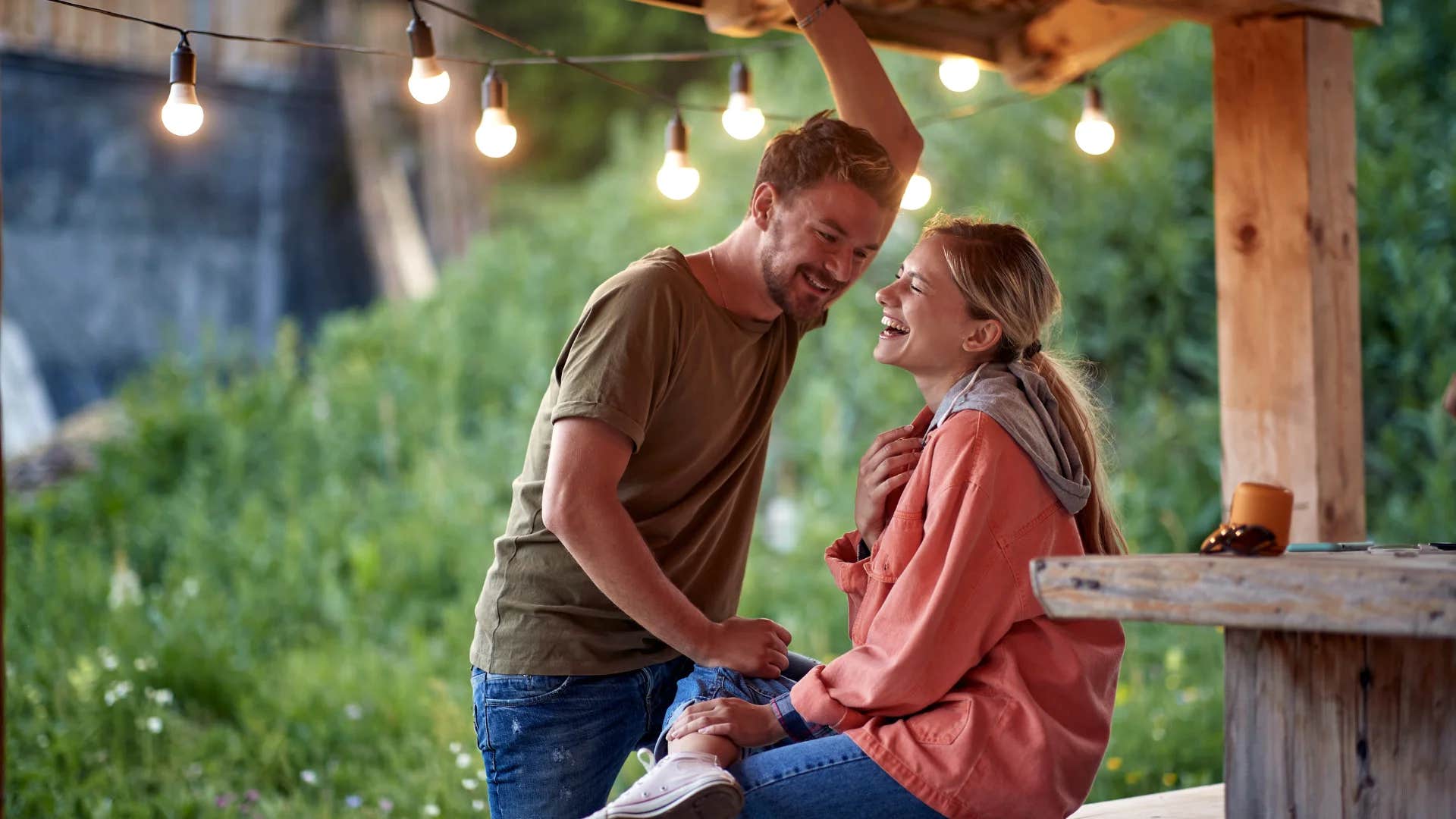 woman telling happy husband go have fun