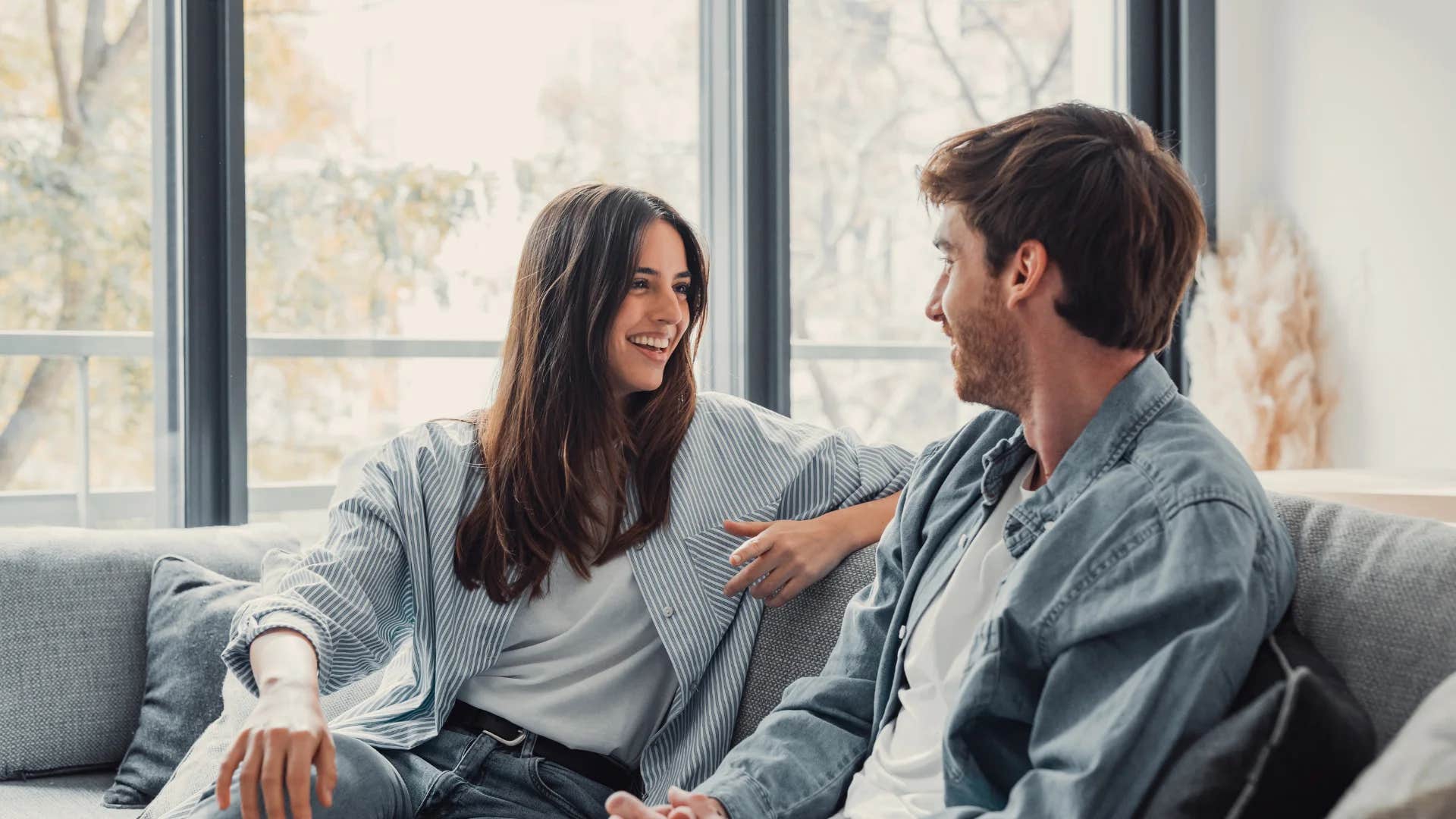 woman telling happy husband i'm proud of you