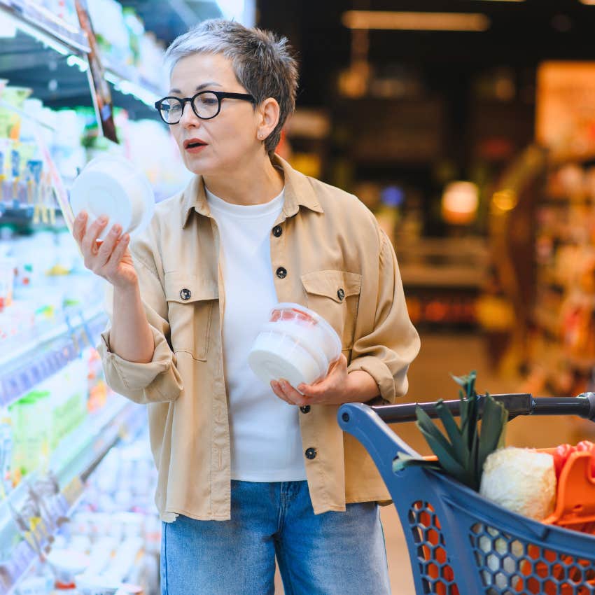 rich woman grocery shopping for fun looking at item prices