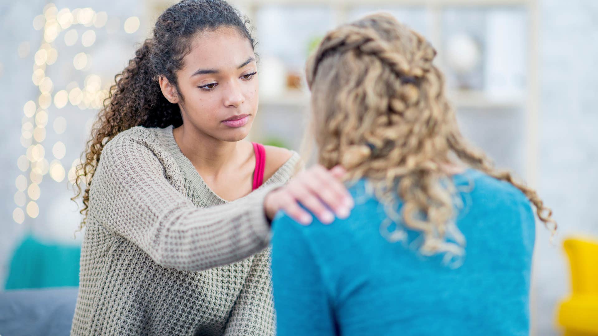 woman being helpful to her friend