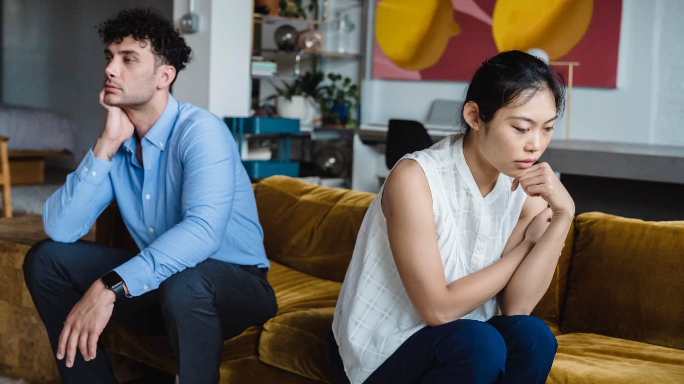 two people facing away from each other on couch 