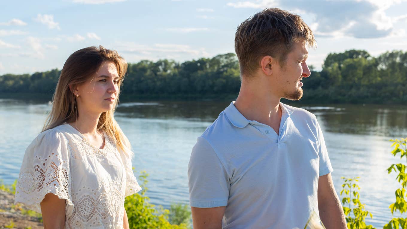 Couple walking by lake 