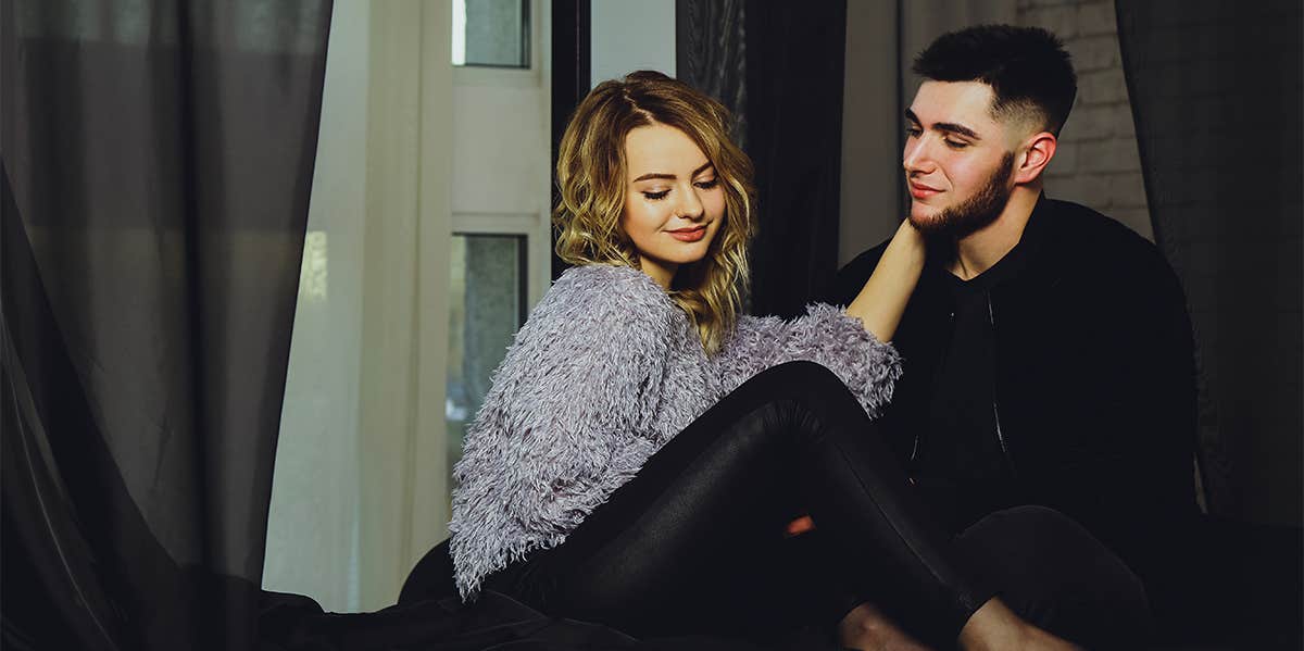 couple sitting on bed