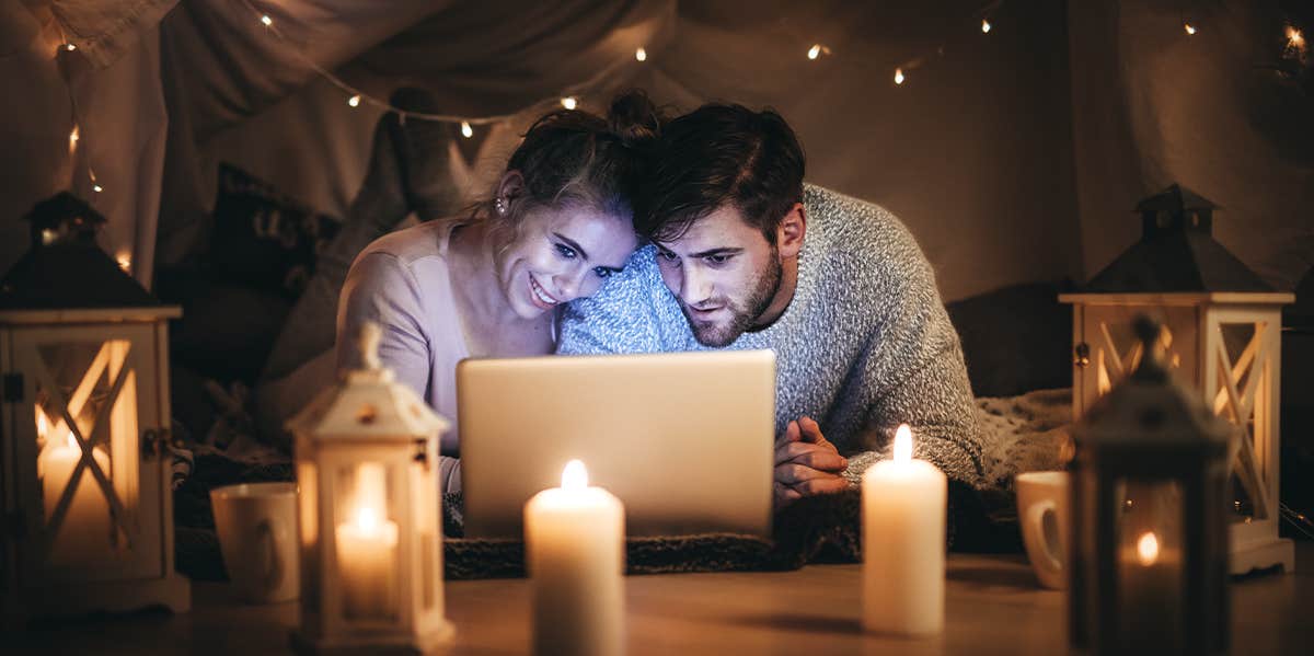 couple watching movie on laptop