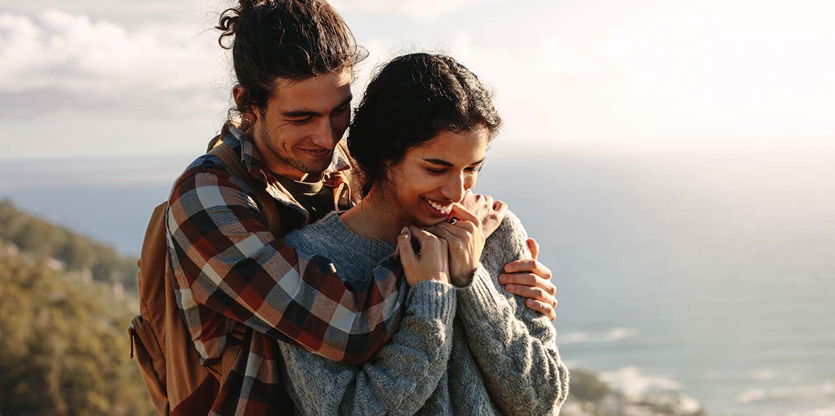 25 Small-But-Beautiful Ways To Show Your Partner Respect man hugging woman from behind