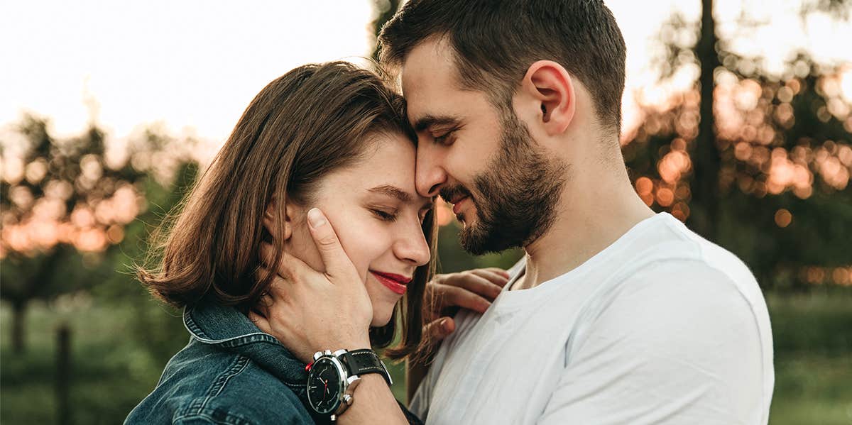 man embracing woman